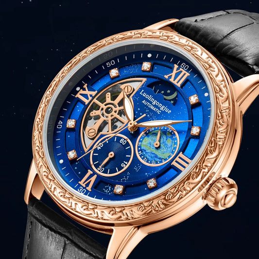 Luxury watch with blue face and rose gold case on a black background